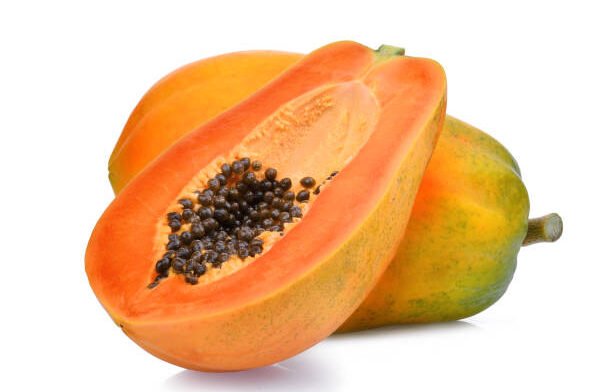 whole and half of ripe papaya fruit with seeds isolated on white background